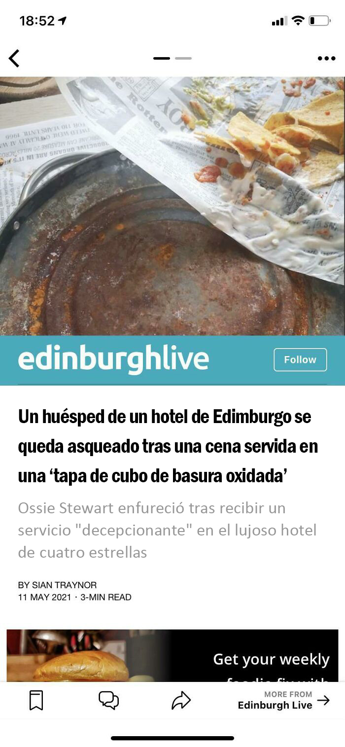 Nachos en una tapa de cubo de basura oxidada 