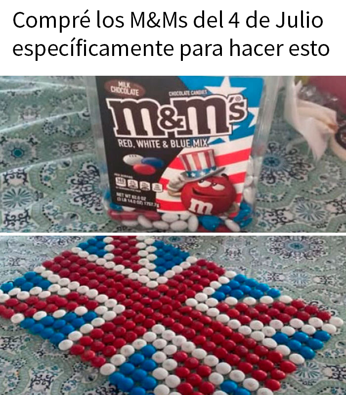 M&Ms de colores rojo, blanco y azul formando la bandera del Reino Unido en una mesa con mantel estampado.