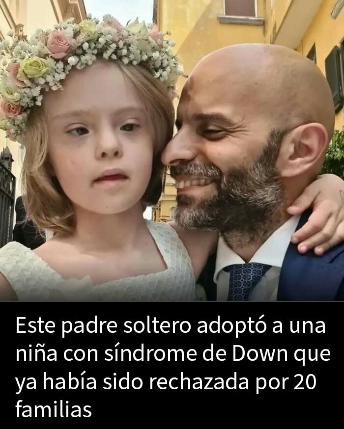 Hombre con barba sosteniendo a niña y mostrando ternura, ilustrando publicaciones adorables y conmovedoras en redes sociales.