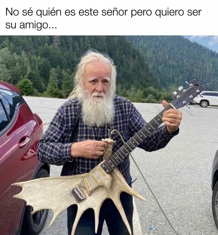 Anciano con una guitarra de asta, estilo de vida de memes sobre paletos americanos.